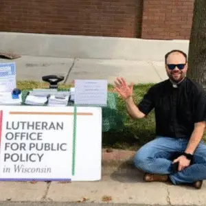 Rev. Andy Twiton next to an LOPPW table.