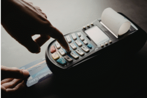 A person using a credit card for a purchase.