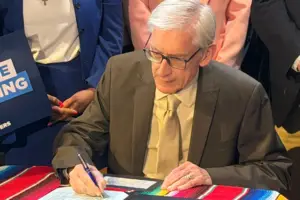 Governor Evers signing the DACA licensure bill.