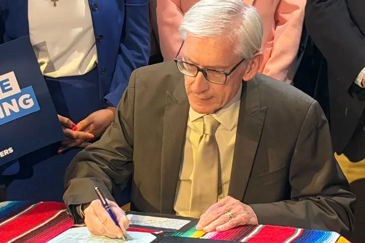 Governor Evers signing the DACA licensure bill.