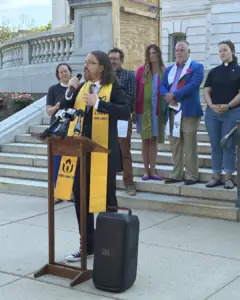 Rev. Kelly Asprooth-Jackson speaking.