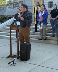 Rabbi Jon Prosnit speaking.